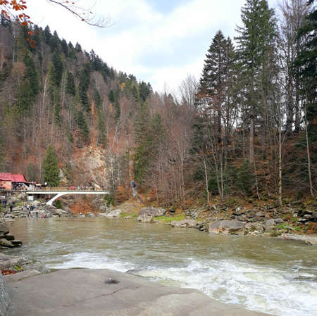 Beautiful bubbling, fast river Prut among the rocky coast in the city of Yaremche in the fall. Western Ukraine, Carpathians, October 27,2018の写真素材
