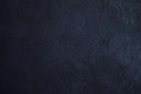 Dark cement wall background and texture. Vintage or grungy background of natural cement or stone old texture as a retro pattern wall.Texture of black concreteの写真素材