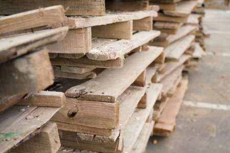 Close-up old wooden pallets.Wood pallet in factory area use for carry material and product supply to customers. Selective focusの写真素材