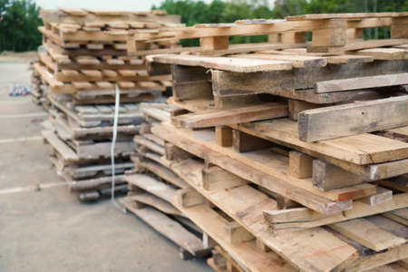 Close-up old wooden pallets.Wood pallet in factory area use for carry material and product supply to customers. Selective focusの写真素材