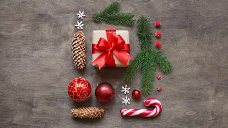 Christmas or new year background, simple composition of christmas decoration gift boxes, red balls,...
