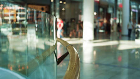 Wooden railings and glass wall in a large shopping center for the comfort of shoppers, modern...