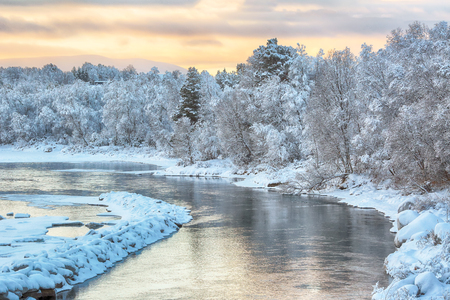 Cold winter sunrise at the norwegian river Glommaの写真素材