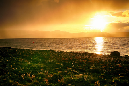 Golden sunset at Trondheim fjordの写真素材