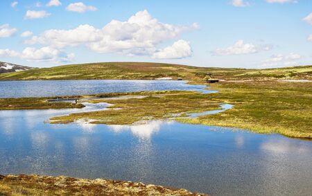 The river Orkla source out of the lake Orkel, Norway