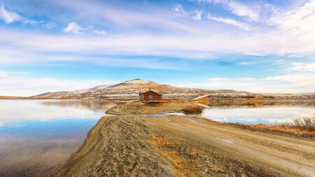 Orkel/Norway 10/20/2018 : first snow in Octover, the view of two lakes Orkel and Masingtjoenna, located very close to each other in the Oppdal areaの写真素材