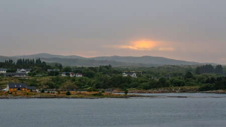 Midnight sun in the village Elvaasen near town Roervik, Norwayの写真素材