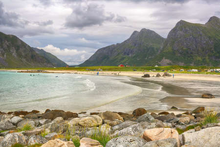 Flakstad beach located on the Norwegian Lofoten islands is popular place for surfing and summer vacationの写真素材