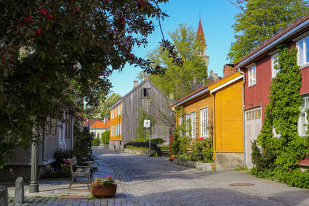 The street in Bakklandet, popular touristic district in Norwegian city Trondheimの写真素材