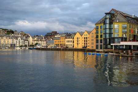Art nouveau architectural buildings reflected in the water in the Norwegian town Aalesundの写真素材