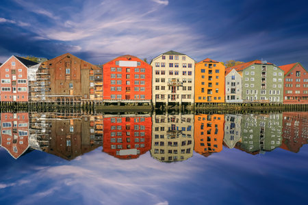 Autumn in Trondheim, view of the river Nidelva and historical timber buildings Bryggeri along the...