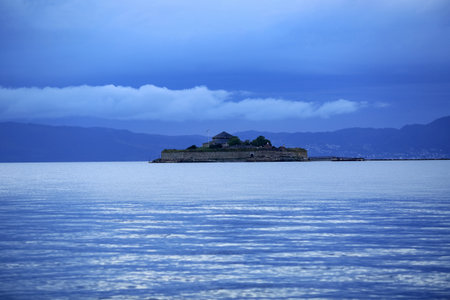 Sunset at Trondheim fjord, view of the island Munkholmen located near the Norwegian city Trondheim
