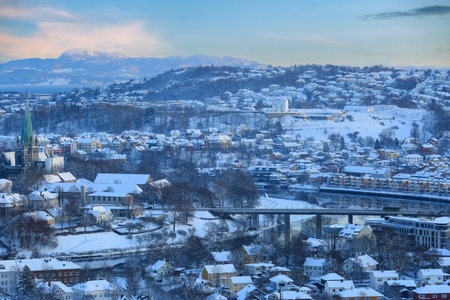 Winter in Trondheim, aerial view of the historical downtown and the river Nidelvaの写真素材