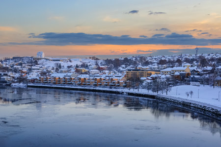 Winter in Trondheim, view of the river Nidelva and  the district Bakklandet reflected in the waterの写真素材