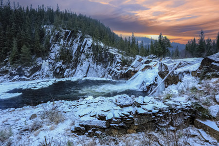 Snowy waterfall Eidfossen located at the river Gaula in Troendelag county, Norwayの写真素材