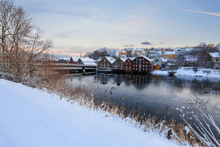 Winter in Trondheim, view of the river Nidelva, The Old Bridge( den Gamle Bybro) and historical timber buildings along the riverの写真素材