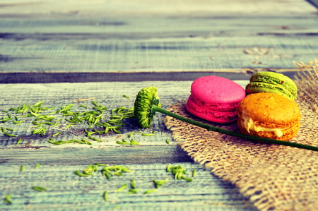 Colorful macaroons on a wooden tableの写真素材