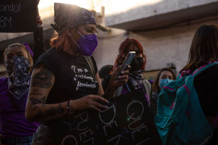 Alternative woman marching in the protest on March 8, 2022, commemorating International Women's Day.のeditorial素材