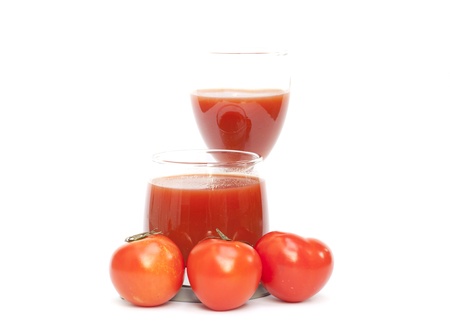 Tomato and juice on the white backgroundの写真素材