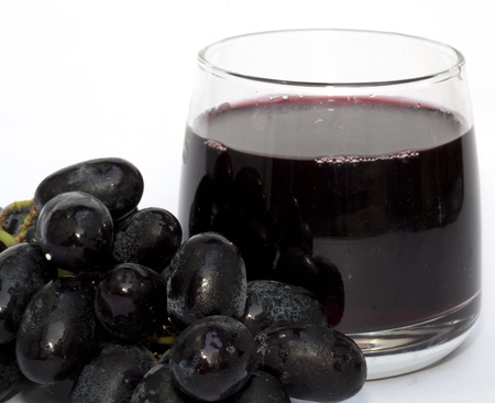 Grape and grape juice on the white backgroundの写真素材