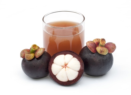 Mangosteen and juice isolated on the white backgroundの写真素材