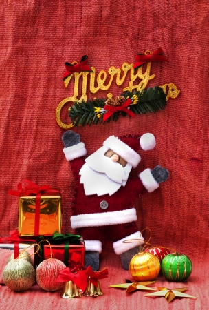Santa Claus and present on the red cloth