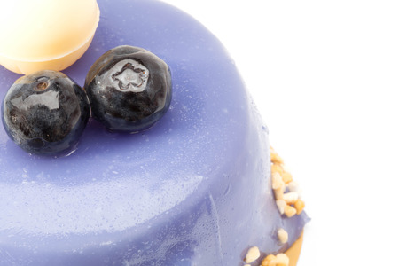 Blueberry cake with white chocolate on topの写真素材