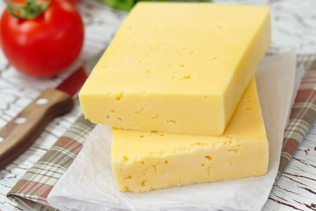 Cheese and fresh vegetables on the table