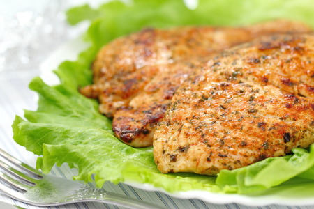 Roasted chicken fillet with vegetables on the tableの写真素材