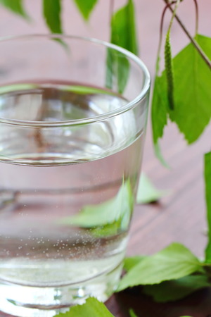 Glass of clean fresh water on natural backgroundの写真素材