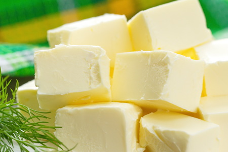 Fresh butter on the tableの写真素材