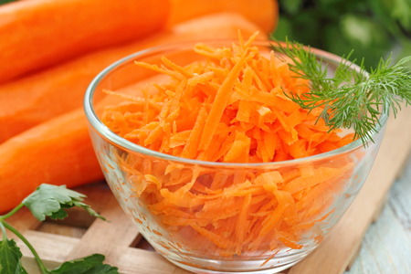 Salad with fresh carrot and greensの写真素材