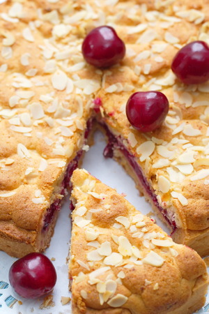 Homemade pie with fresh cherries on tableの写真素材