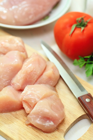 Raw chicken fillet prepared for cookの写真素材