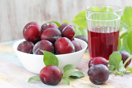 Fresh plum juice and ripe fruitの写真素材
