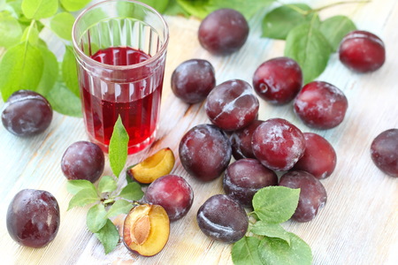 Fresh plum juice and ripe fruitの写真素材