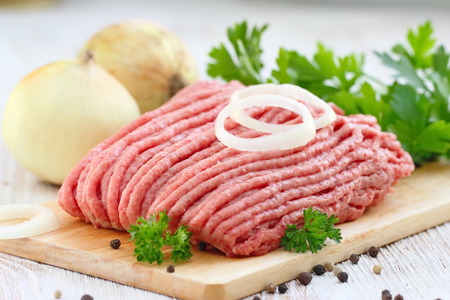 Fresh raw minced meat with spices ready to be cooked