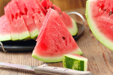 Slices of watermelon on the table in summertimeの写真素材