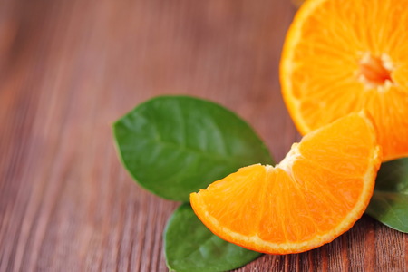 Fresh fruit tangerines on the wooden tableの写真素材