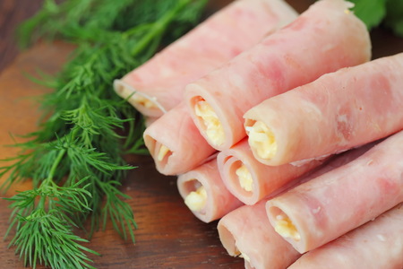 Delicious rolls made of ham stuffed with cheese, garlic and mayonnaiseの写真素材