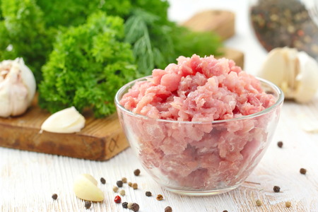 Fresh raw minced meat with spices ready for cooking