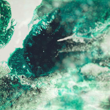 Liquid Acrylic paint, liquid artwork, abstract colorful background with colored painted cells, stains. Green retro colorsの写真素材