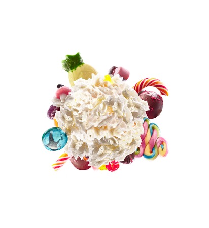 Whipped round cream with colored sweets, jelly and candies isolated. Sweet life concept. Sweet dessert - whipped milk cream concept with treat, kid cartoon colorful cream, white whipped cream with colored sweets. Monster freak milk shake whip creamの写真素材