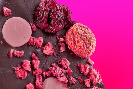 Strawberry chocolate, macro photo with piece of strawberries and raspberries. Strawberries and raspberries chocolate sliceの写真素材