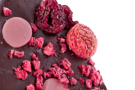 Strawberry chocolate, macro photo with piece of strawberries and raspberries. Strawberries and raspberries chocolate sliceの写真素材