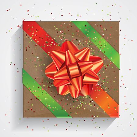 Brown gift box with big red bow and red and green ribbons isolated on white background. Christmas and Birthday package, selebration realistic gift box, top viewの写真素材