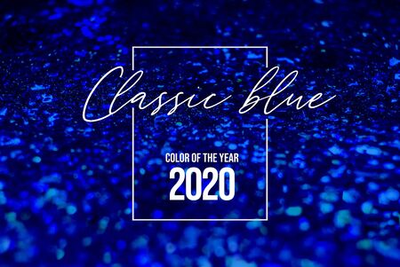 Classic blue glitter shiny background. Color of the 2020 year, pallette with deep classic blue...