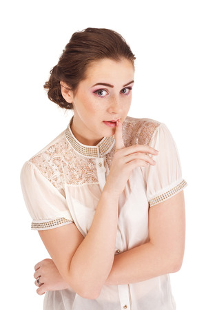 Woman saying be quiet by saying shhの写真素材