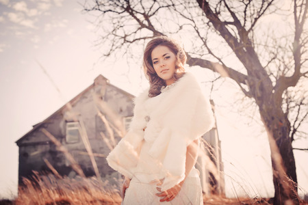 Girl in white dress. Bride in the park. Photo in vintage style. Mystery.の写真素材