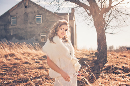 Girl in white dress. Bride in the park. Photo in vintage style. Mystery.の写真素材